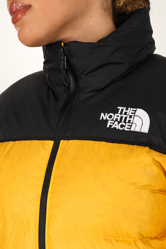 Doudoune the north discount face noir et jaune